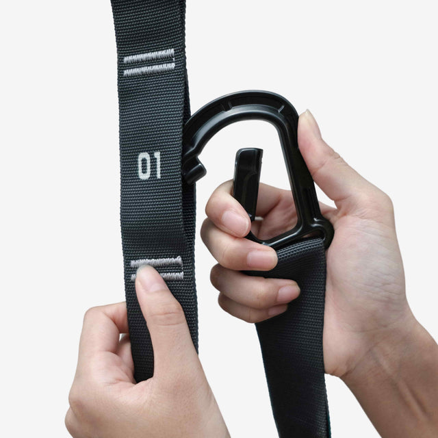 attaching grav gymnastic rings carabiner to numbered straps